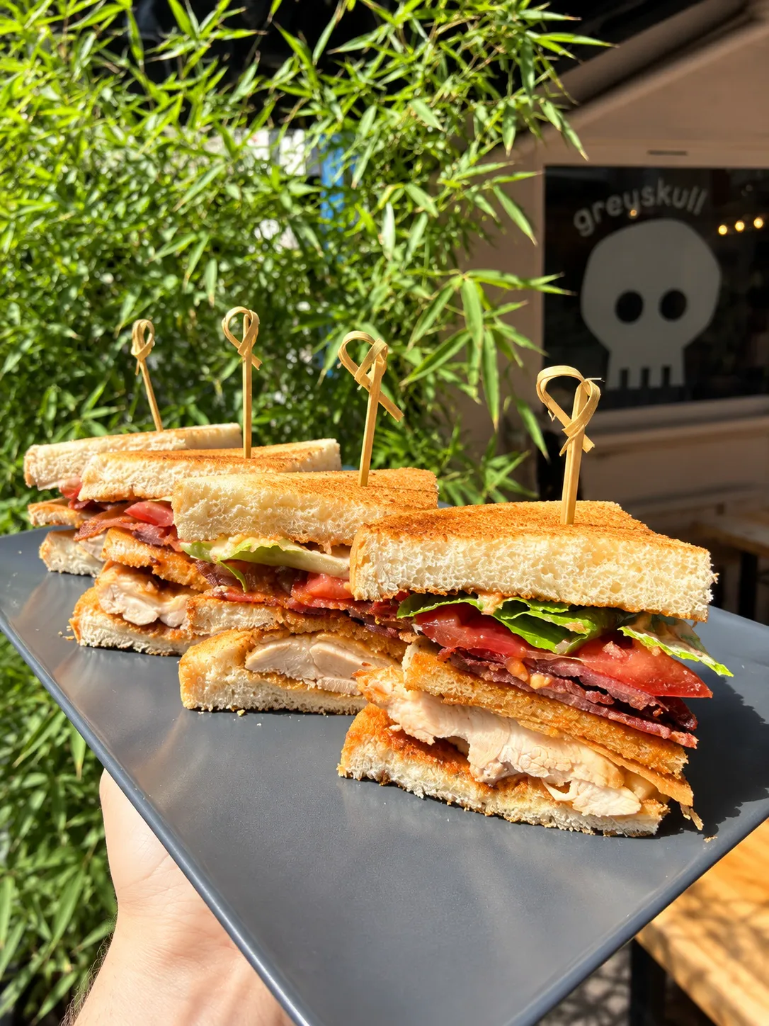 Club sandwich served with coffee at Greyskull